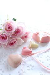 Pink rose and heart shaped chocolate