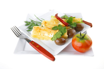 cheese cannelloni served with greenery on dish