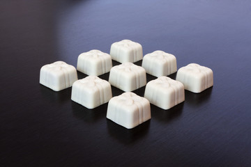 candy white chocolate on a dark background