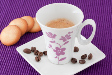 an elegant cup of coffee with biscuits