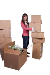 young girl packing up and moving - isolated