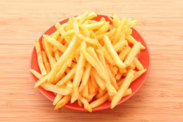 fried potatoes on the plate  on white background