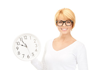 woman holding big clock