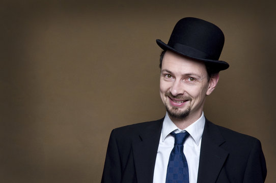 Businessman with bowler and smile