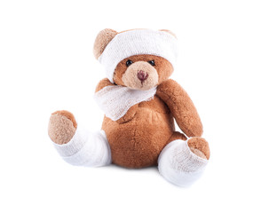 Sick teddy bear wrapped in bandages