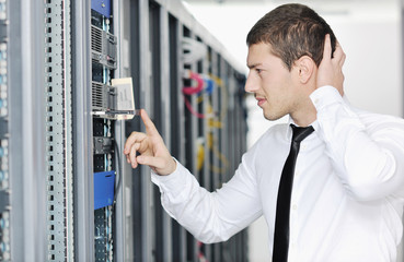 Fototapeta premium young it engeneer in datacenter server room