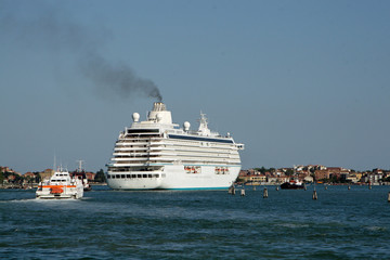 giant ocean liner is transported out of the port of Venice