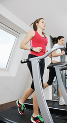 Fototapeta premium woman workout in fitness club on running track