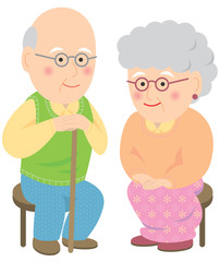 笑顔で座る老夫婦