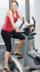 Fototapeta na wymiar woman workout in fitness club on running track