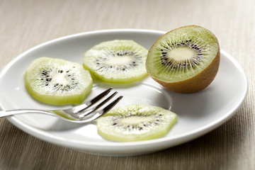 Fototapeta na wymiar Kiwi Slices on a Dish