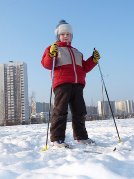 Boy skiing in the city
