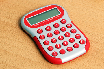 Red calculator on a table