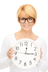 woman holding big clock