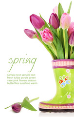 Spring tulip flowers in boots - 29459591