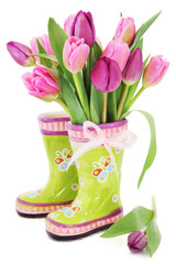 Spring tulip flowers in boots - 29459593