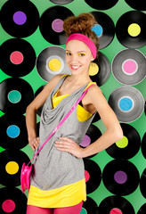 studio shot of cheerful teenage girl over colorful background