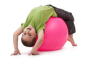 Little boy doing gymnastic exercises © Grafvision