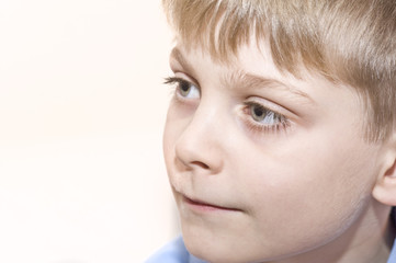 Portrait of young boy looking away from camera