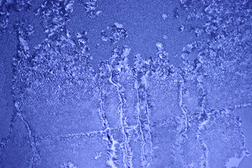 Frost patterns on window glass in winter