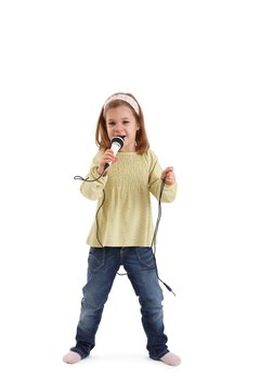 Little girl singing with microphone