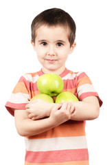 Little boy holding apples