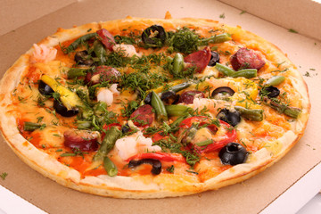 fresh baked pizza with pepperoni olives and peppers