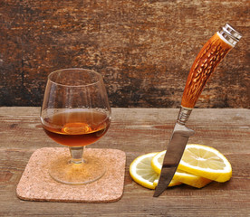 classic cognac with lemon and knife