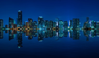 Miami skyline night panorama with beautiful reflections