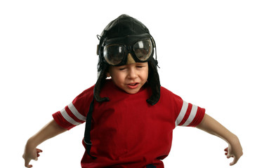 Small boy in the pilot's cap flying