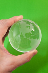 Hand holding a Globe