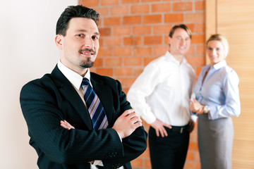 Realtor in apartment with couple