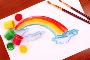 Children drawing of a rainbow on a paper
