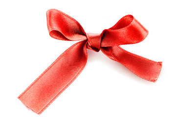 Red satin gift bow isolated on white