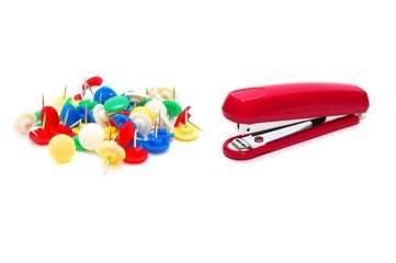Red stapler with colour drawing pins
