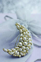 pearl brooch with golden glow