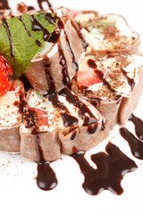 Tiramisu Sushi Roll garnished with Strawberry and Mint