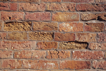Reddish building block stone brick wall texture