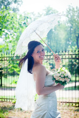 Bride portrait with lacy umbrella