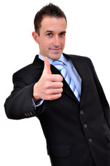 Young happy business man going thumbs up, isolated on white