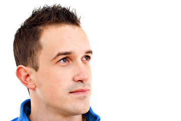 Fototapeta premium Closeup portrait of a handsome happy young man, looking up