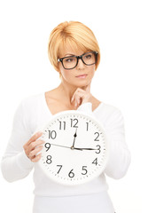 woman holding big clock