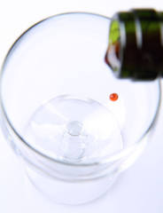 Red wine being poured into a wine glass