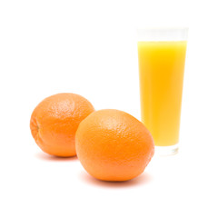 oranges and a glass of orange juice , isolated on white
