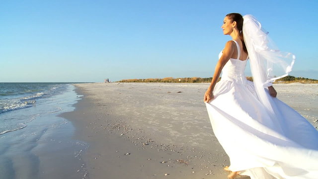 Beautiful Bride in Wedding Dress on the Beach