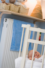 Fototapeta na wymiar baby sleeping in crib