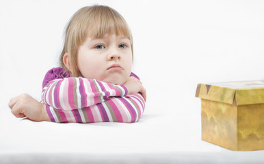 The thoughtful girl with a box.