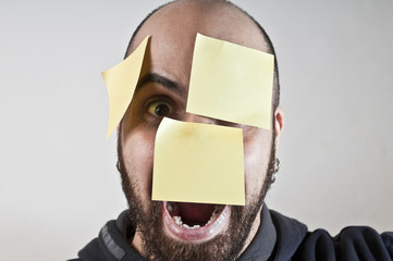 disparate man with postit on his face
