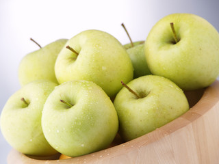 Wet Green Apples On A Bowl