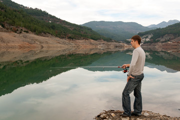 Fototapeta na wymiar man with a fishing